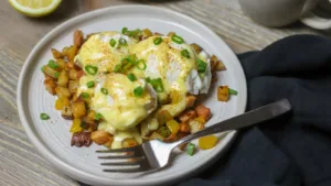 Eggs Benny, Hashbrowns and a steaming cup of freshly brewed coffee