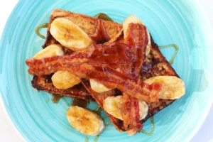 French toast with bacon, sausage and caramelized bananas