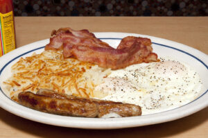 Fantastic Eggs, Bacon, sausages and Hash Browns along with a hot mug of coff